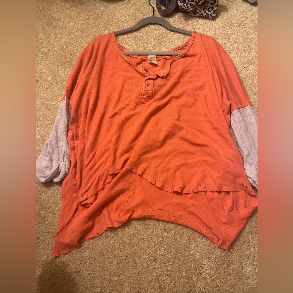 Free People orange top/shirt. No stains, no flaws. Not sold anymore online.